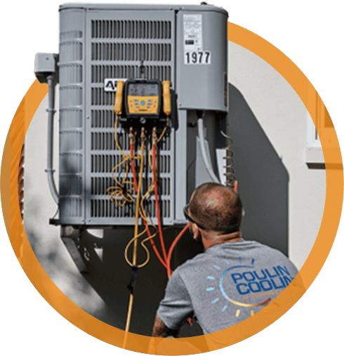 Technician servicing an air conditioning unit, featuring diagnostic equipment and Poulin Cooling branding, illustrating HVAC maintenance services in Belleair, FL.