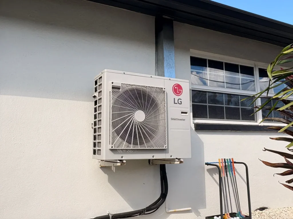Outdoor LG HVAC unit installed on a building exterior for cooling.